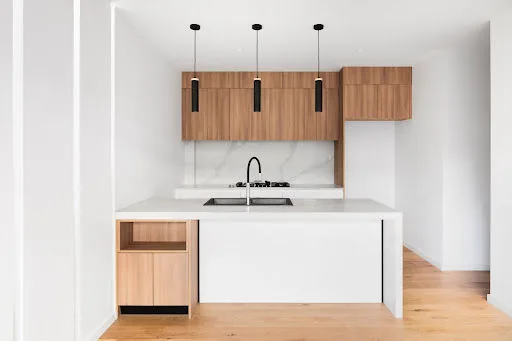 Laminate wood kitchen cabinet design for your modular kitchen - Beautiful Homes