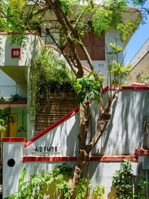 White and Red Coloured Studio Exterior - Beautiful Homes