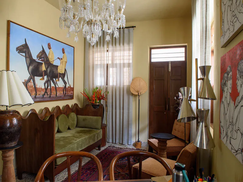 Sitting Room with a Statement Painting Piece - Beautiful Homes