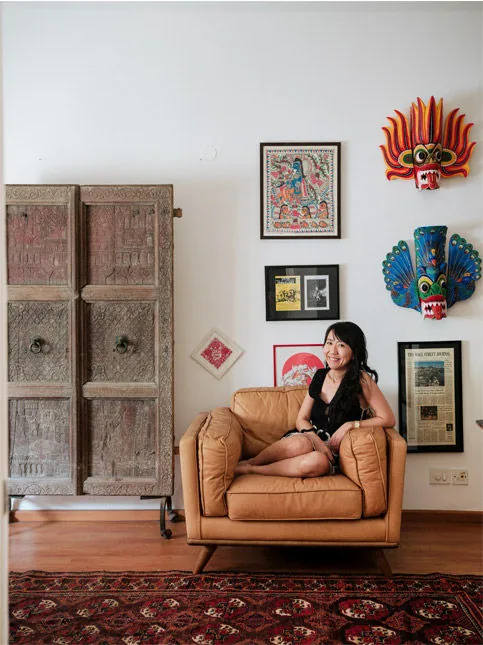 Rajasthani carved wood door and painted Sri Lankan masks - Beautiful Homes