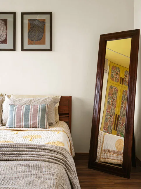 Another bedroom in the house with the standing, full-length mirror reflects the wardrobe in yellow, with the – Beautiful Homes