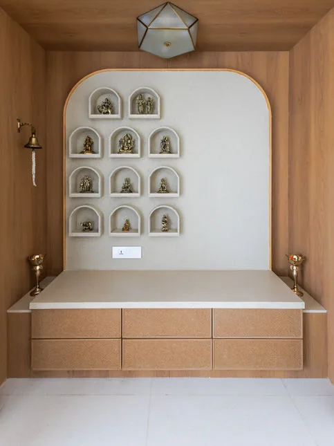 Custom prayer alcove with arched backdrop and illuminated niches - Beautiful Homes