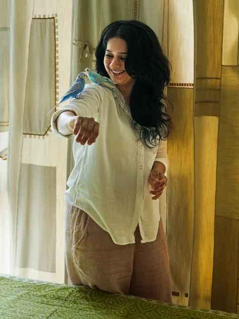 Tasneem Rangwala with budgies inside Bayt-ul-Sumud - Beautiful Homes