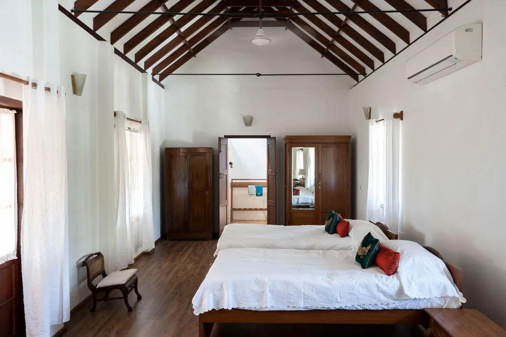 Bedroom design has wooden flooring matching with furniture & bedroom rafters - Beautiful Homes