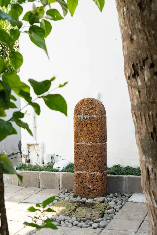 Garden tap in stone matches the house’s rustic interiors - Beautiful Homes