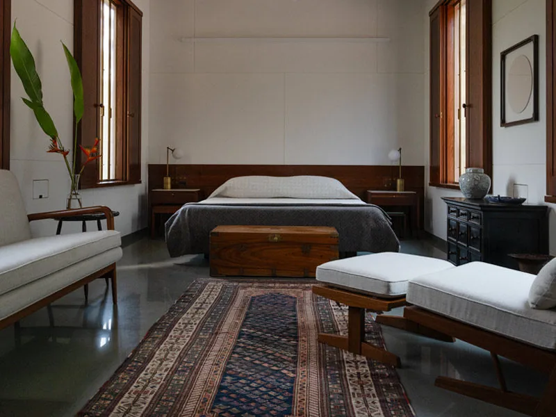 Copper House II master bedroom with restored architectural elements - Beautiful Homes